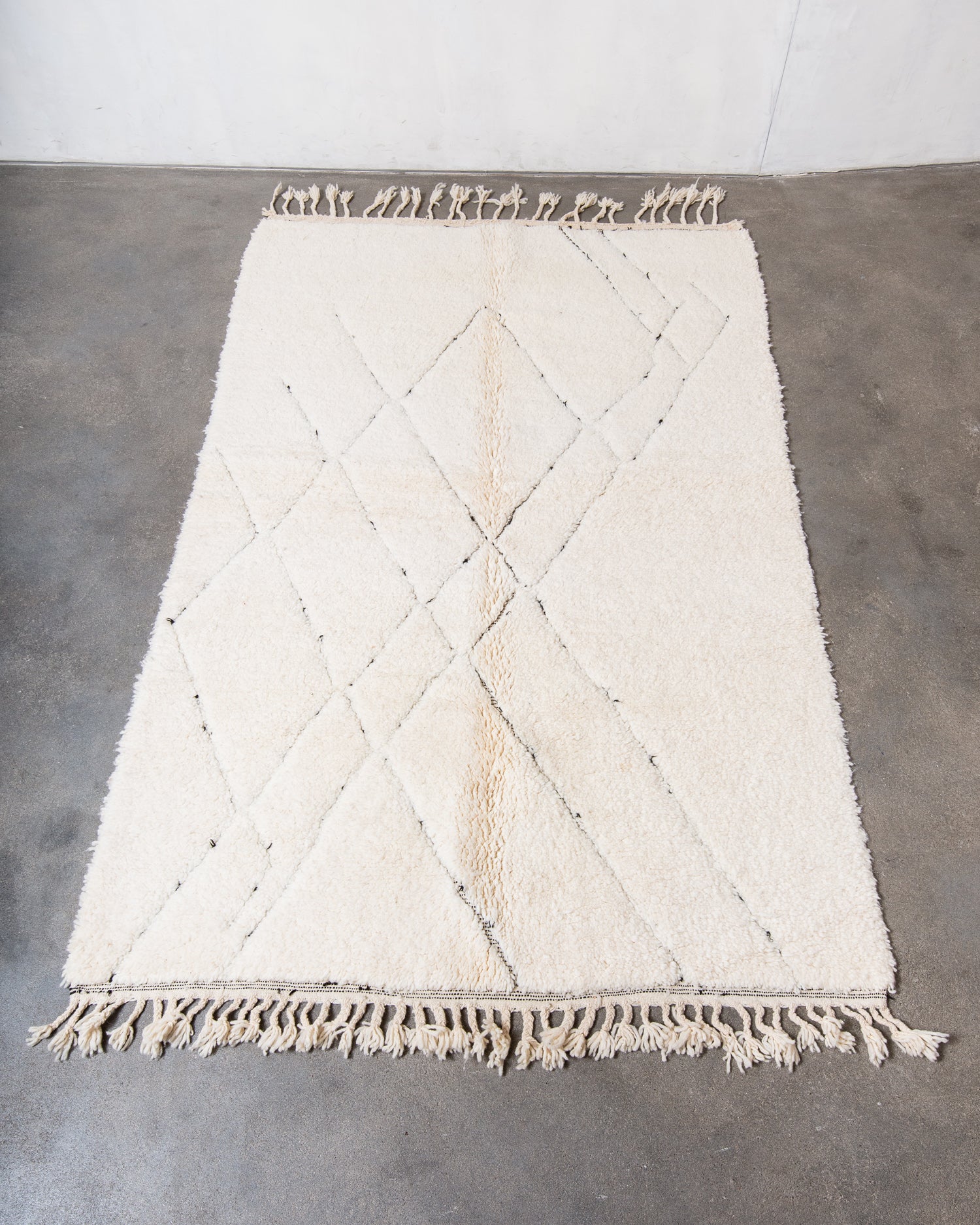 Modern, designer, handcrafted Berber rug from Morocco. Beniourain carpet with minimalist design, natural wool pile and a fluffy texture.
